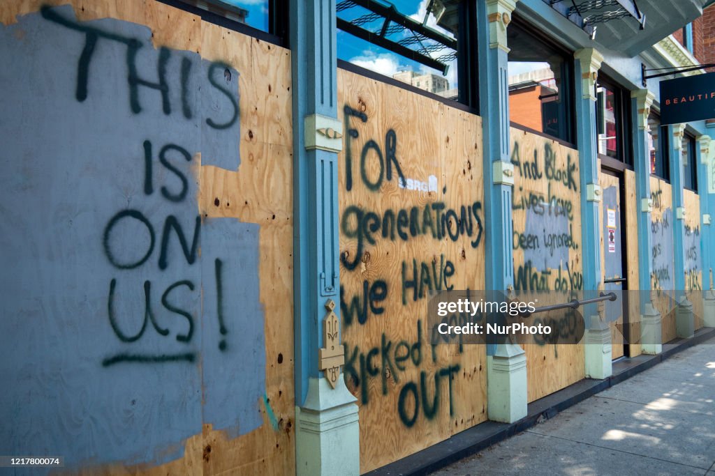 Shuttered Storefront Downtown businesses have shuttered their storefront windows and doors ...