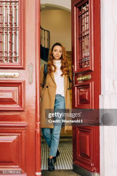 young woman leaving home - leaving door stock pictures, royalty-free photos & images