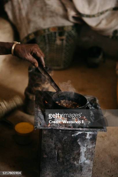 cropped image of woman preparing coffee during traditional ceremony, ethiopia, central tigray, mugulat - ethiopia coffee bildbanksfoton och bilder