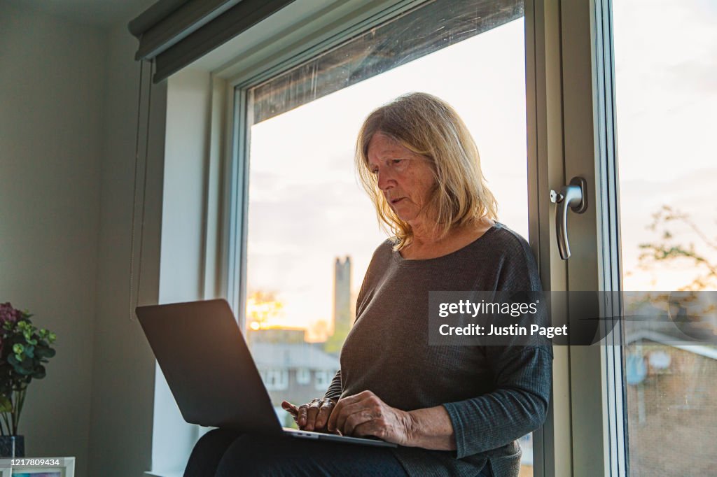 Senior lady on laptop - negative emotion