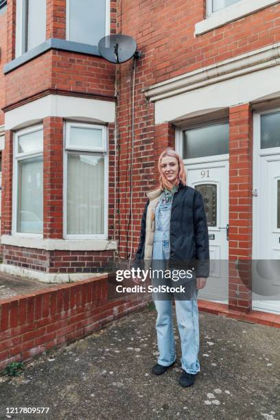 proud home owner - person in front of house stock pictures, royalty-free photos & images