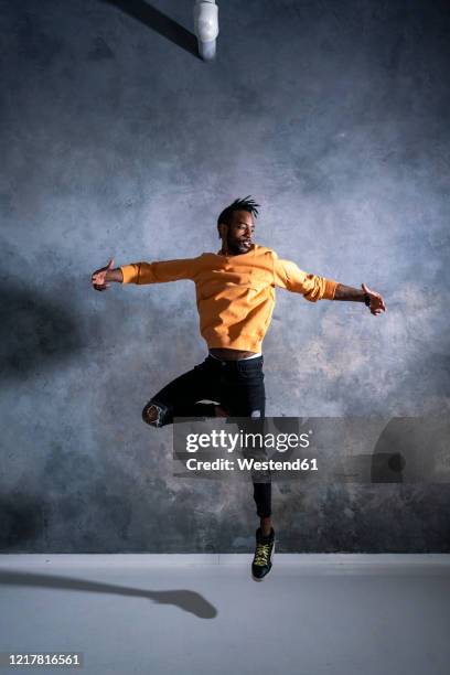 young man jumping and dancing - ballet dancers russia stock-fotos und bilder