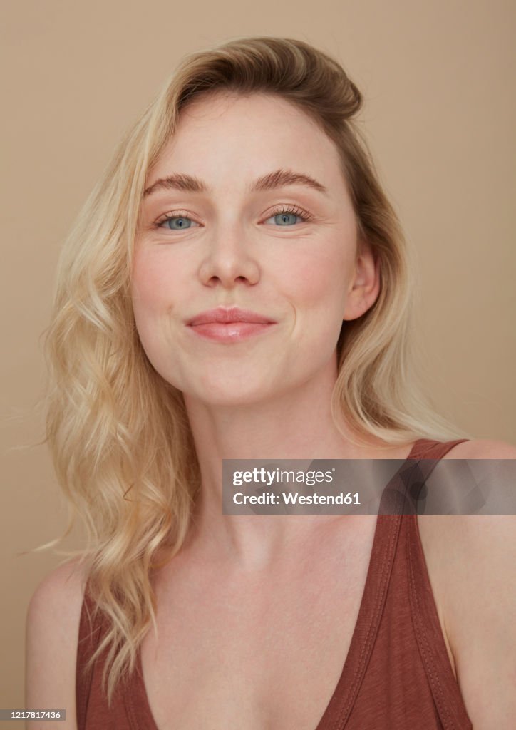 Portrait of smiling blond young woman