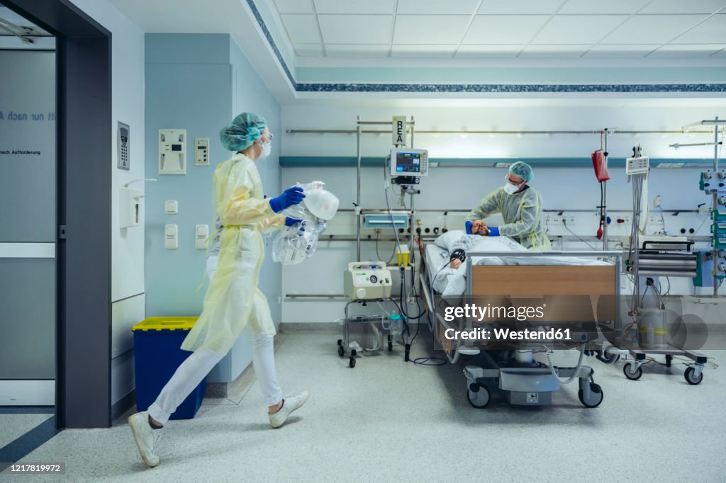 Doctors in a hurry caring for patient in emergency care unit of a hospital