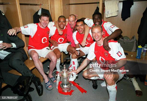 Oleg Luzhny, Gilberto, Freddie Ljungberg, Giovanni van Bronckhorst, Dennis Bergkamp and Kolo Toure of Arsenal with the FA Cup Trophy after the FA Cup...