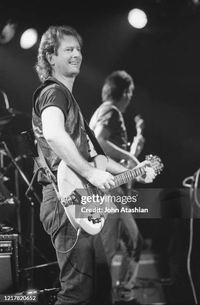 Singer, songwriter and guitarist Roger McGuinn is shown performing on stage during a "live" concert appearance on April 10, 1991.