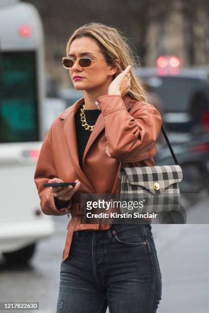 Digital influencer Anne Laure Mais wears Jonathan Simkhai jacket, Levis jeans on February 27, 2020 in Paris, France.