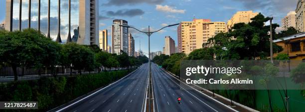 sao paulo, brazil - essential services in a 23 de maio avenue with all lanes empty - empty street stock pictures, royalty-free photos & images