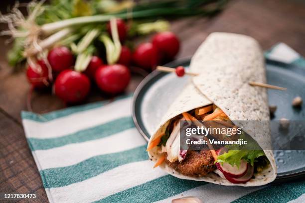 falafel in tortila wrap's - wrapped burrito stock pictures, royalty-free photos & images