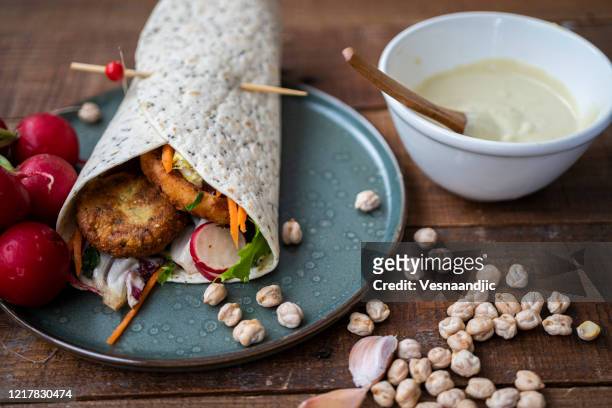 falafel in tortila wrap's - wrapped burrito stock pictures, royalty-free photos & images