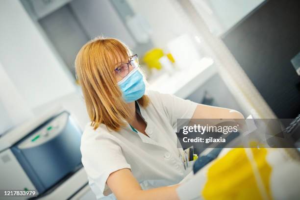 Lab Operator Using Excel In Computer Lab Technician Entering Data Into A Computer High-Res Stock Photo ...