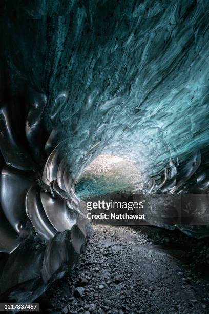 crystal blue ice cave under vatnajokull glacier, iceland - crystal caves ストックフォトと画像