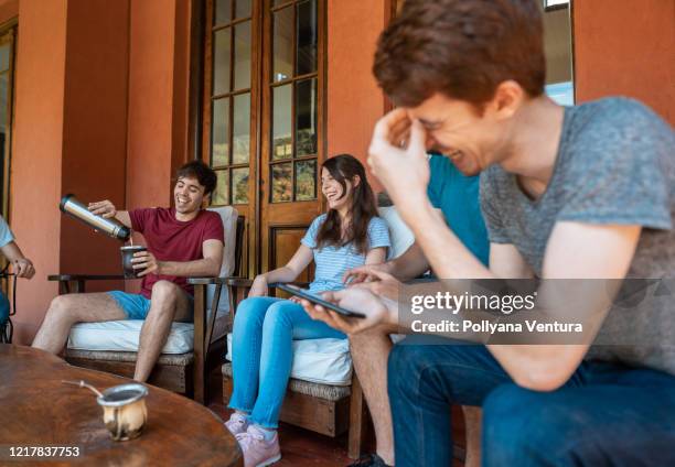 friends sitting talking and drinking yerba mate - mate argentina stock pictures, royalty-free photos & images