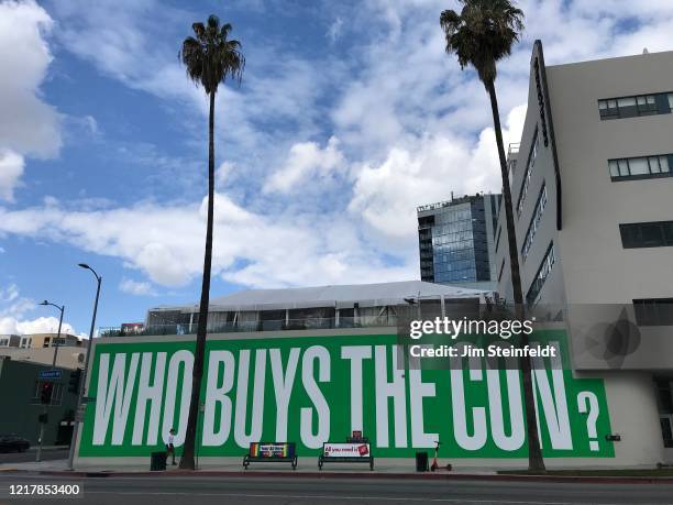 Who Buys The Con sign on Sunset Blvd in Los Angeles, California on February 22, 2020.