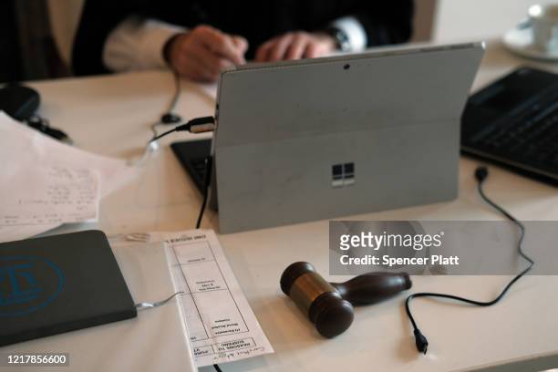 Gavel sits on the table as New York City Criminal Court Judge Paul McDonnell works remotely from his Brooklyn apartment due to the coronavirus...