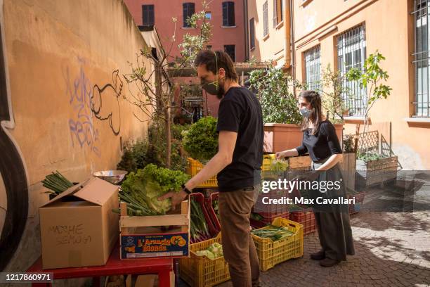 Cohousing in downtown distributes vegetables from biological farms to residents on April 09, 2020 in Bologna, Italy. There have been well over...