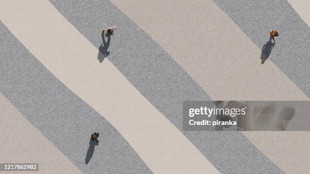 social distancing - three people walking stock pictures, royalty-free photos & images