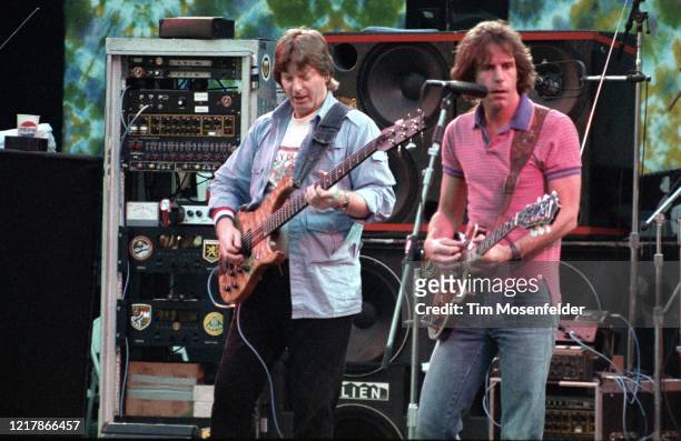 Phil Lesh and Bob Weir of the Grateful Dead perform at the Greek Theatre on August 14, 1983 in Berkeley, California.