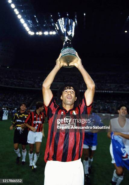 Ruud Gullit of AC Milan lift the trophy after winnings the Supercoppa italiana 1994 match between AC Milan and Sampdoria at Stadio Giuseppe Meazza on...
