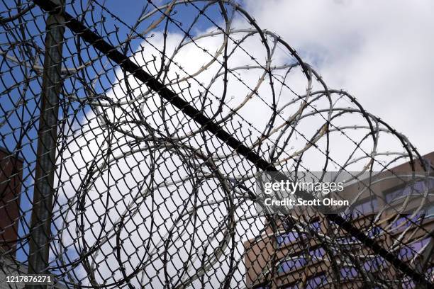 Fence surrounds the Cook County jail complex on April 09, 2020 in Chicago, Illinois. With nearly 400 cases of COVID-19 having been diagnosed among...