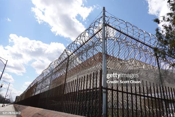 Fence surrounds the Cook County jail complex on April 09, 2020 in Chicago, Illinois. With nearly 400 cases of COVID-19 having been diagnosed among...