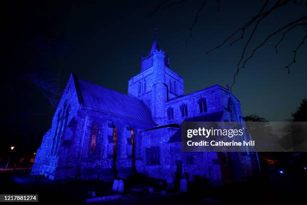 St.Mary's Church is lit up blue as part of Clap for Carers on April 09, 2020 in Aylesbury, United Kingdom. Following the success of the "Clap for Our...
