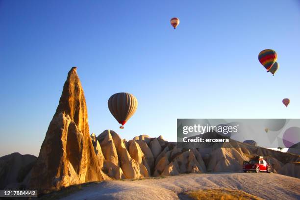 hot air balloons in cappadocia - rock hoodoo stock pictures, royalty-free photos & images