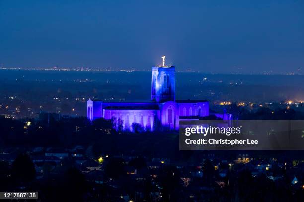 Guildford, Guildford Cathedral is lit up blue as Thanks to NHS And Key Workers Throughout Coronavirus Outbreak on April 09, 2020 in Guildford, United...