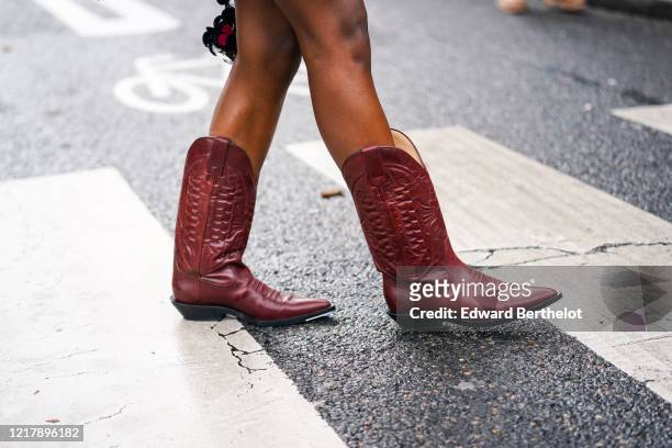 Guest wears dark brown leather pointy cow-boy boots, outside Paco Rabanne, during Paris Fashion Week - Womenswear Fall/Winter 2020/2021, on February...