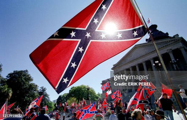 Confederate flag supporters demonstrate on the north steps of the capitol building 06 April, 2000 in Columbia, SC. The US southern state is split...