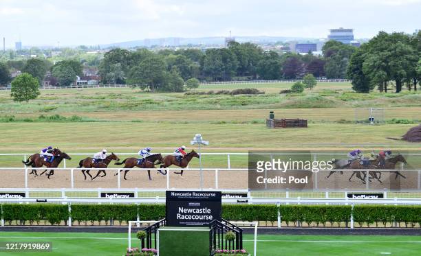 General view as Tadleel ridden by Tony Hamilton approaches the finish line to win the Betway Casino Handicap at Newcastle Racecourse on June 06, 2020...