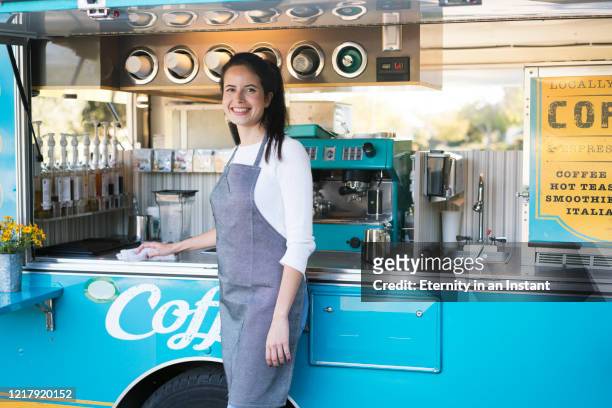Young woman working at a food truck
