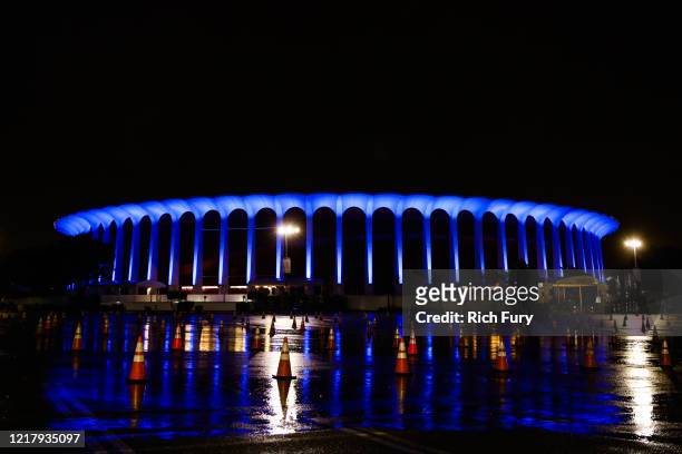 The Forum is illuminated in blue lights as part of the #LightItBlue for Health Workers movement on April 09, 2020 in Inglewood, United States....