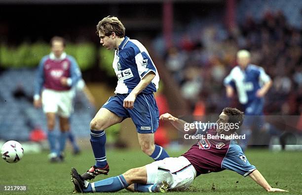 Gary Croft of Blackburn Rovers is challenged by Simon Grayson of Aston Villa during the FA Carling Premiership match against Blackburn Rovers played...