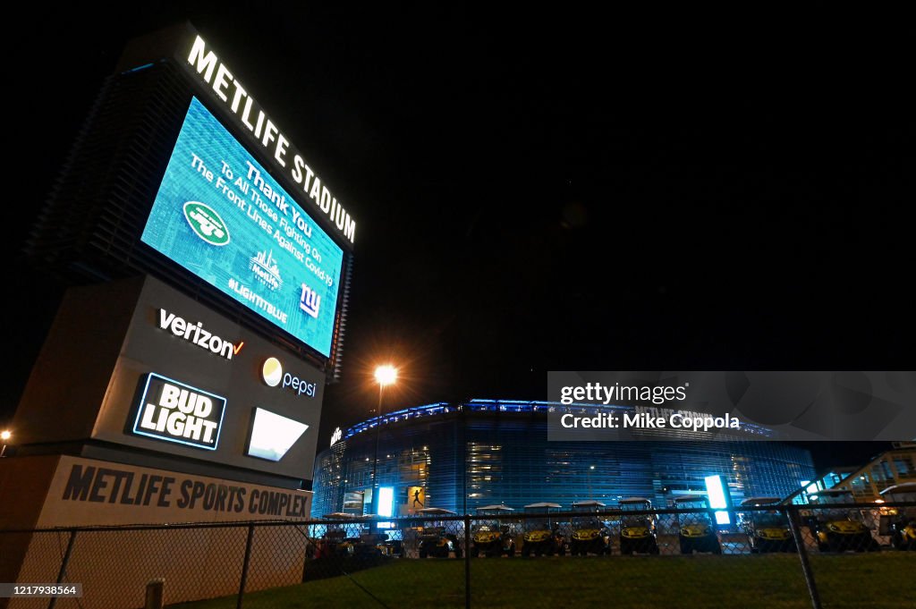 Across U.S., Stadiums, Landmarks Illuminated In Blue To Honor Essential Workers