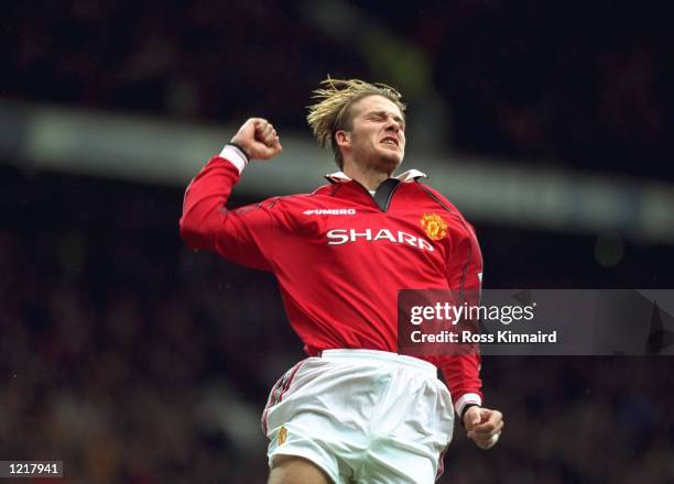 David Beckham of Manchester United celebrates after scoring a goal during the FA Carling Premiership match against Wimbledon played at Old Trafford...