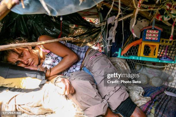 a migrant lives in abject poverty in a shack near the us-mexico border in tijuana in northern mexico - san diego homes stock pictures, royalty-free photos & images