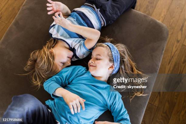 above view of happy boys talking on sofa at home. - children only stock pictures, royalty-free photos & images
