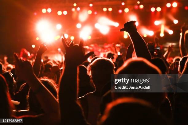 concert audience, rear view concert crowd, music festival - concert hall stage stock pictures, royalty-free photos & images