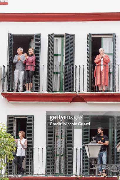 Citizens applaud the effort of the sanitaries from their balconies on April 09, 2020 in Seville, Spain. Due to the COVID-19 outbreak in Spain,...