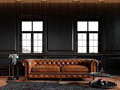 Classic loft black interior with wood panel, chesterfield couch, carpet, flowers, coffee table and windows. 3d render illustration mock up.