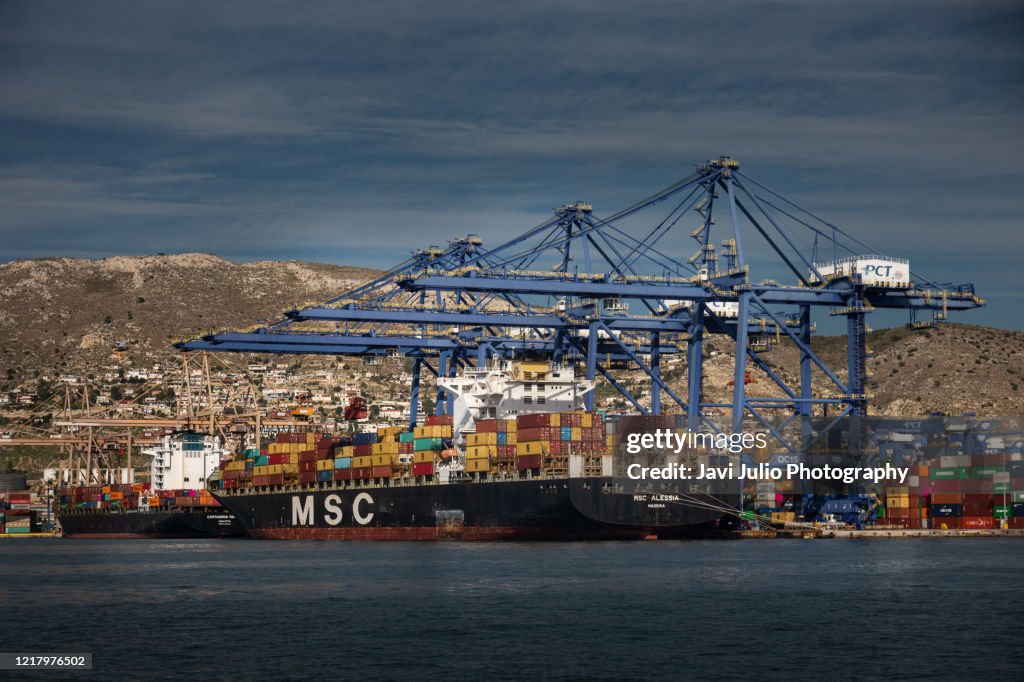 Athens Container Terminal Shipping Vessels Deposit Their Container Cargo In The Port Of Piraeus ...