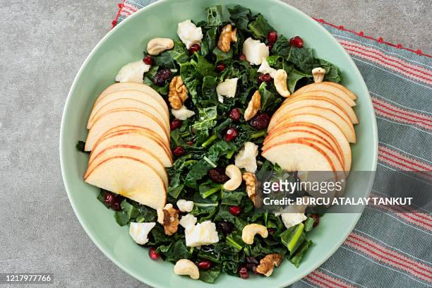 kale and apple salad with feta cheese and nuts - crucifers stock pictures, royalty-free photos & images