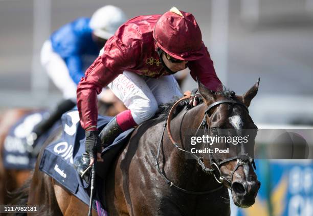 Kameko ridden Oisin Murphy approaches the finish line to win the Qipco 2000 Guineas Stakes at Newmarket Racecourse on June 06, 2020 in Newmarket,...