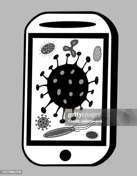 cleaning the smartphone of germs and bacteria - bakterie stock pictures, royalty-free photos & images