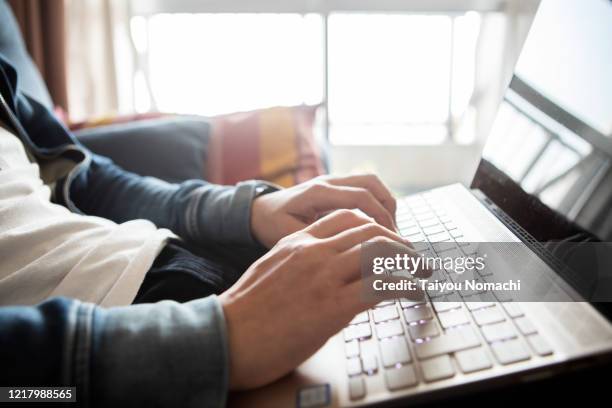 close up of male hands using laptop - input device stock-fotos und bilder