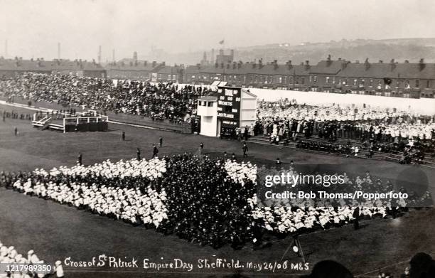 Vintage postcard featuring a human Cross of St Patrick on Empire Day on the cricket pitch at Bramall Lane in Sheffield on 24th May 1906.