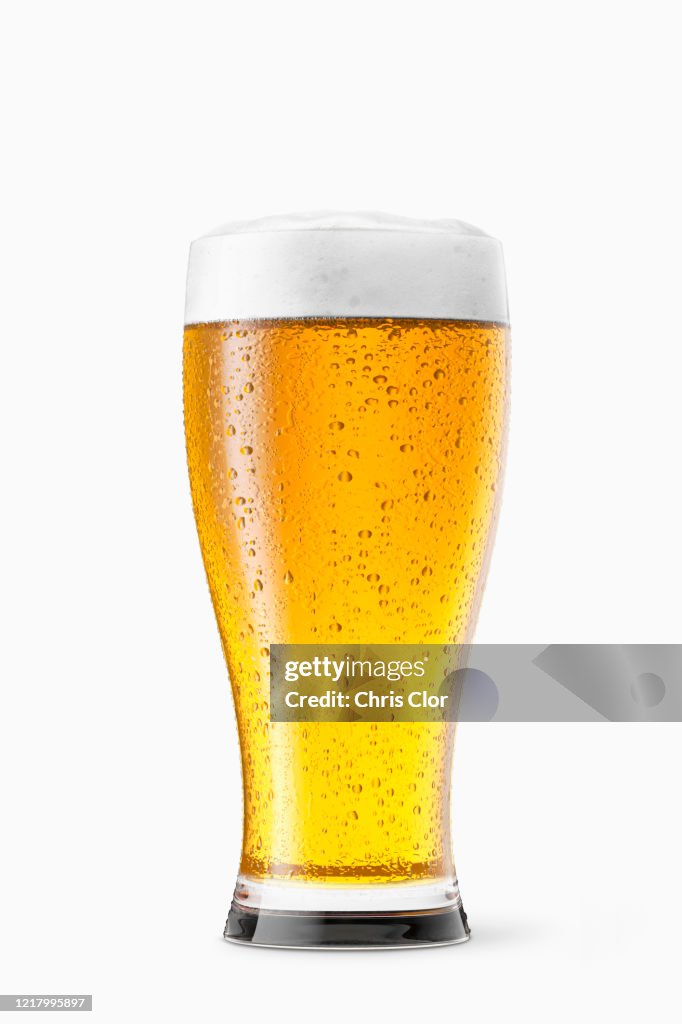 Glass of beer on white background