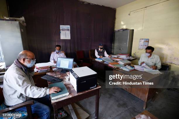 Government employees seen at work after the offices reopened following the ease in lockdown restrictions, in Old Secretariat, on June 6, 2020 in...