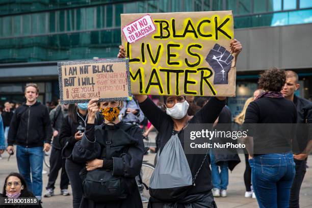 People protest against racism and police brutality and pay tribute to George Floyd in Alexanderplatz in Berlin, Germany on June 06, 2020. About...